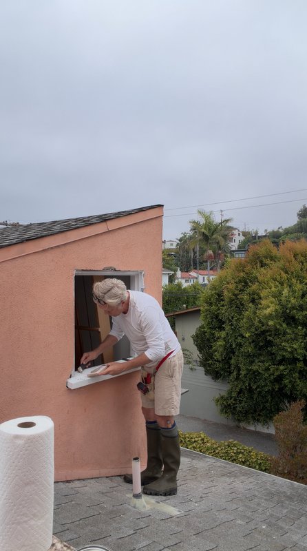 Caulking the glass perimeter.